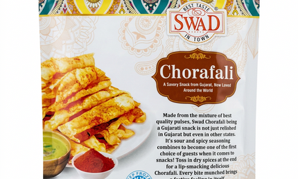 A 7 oz bag of Swad in Town Chorafali snack, featuring a colorful patterned top border, a white center with product imagery, and orange accents, photographed on a dark textured surface.
